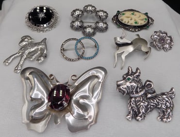 Nine beautiful vintage sterling silver broaches