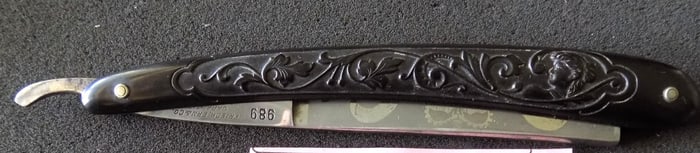 Fancy antique straight razor with original box