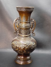 Ornate vintage bronze Oriental vase