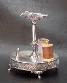 Unusual ornate silverplated figural sewing thread holder with bird