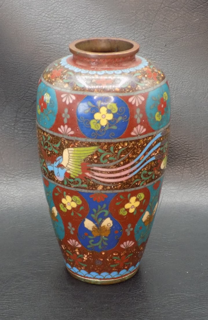 Highly decorated vintage cloisonne Oriental vase: Highly decorated vintage cloisonne Oriental vase. Beautiful colors. Has a small fleabite and is hard to see near top shoulder as shown in photo. Beautiful colors. In very good original as found condit