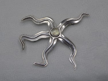 Vintage Clifford and Russell sterling silver broach with cabochon.