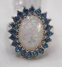 Beautiful 6 cwt rainbow opal and blue topaz sterling silver ring