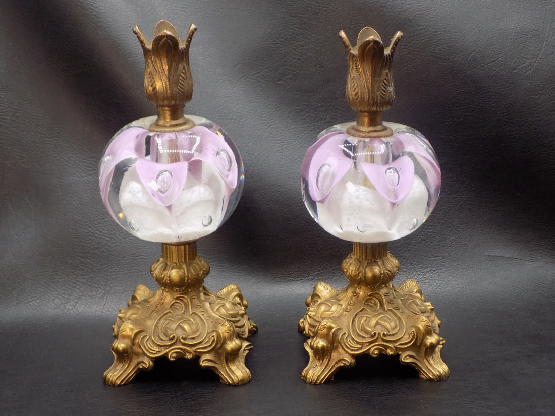 Beautiful pair of midcentury Venetian Murano art glass lamps: Beautiful pair of midcentury Venetian Murano art glass lamps. The wiring has been removed and used as candle holders. Paper weight form centers. Original patina on metal. Great quality and detail. In