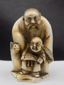 Fine vintage carved Oriental Netsuke. With man, child and horse