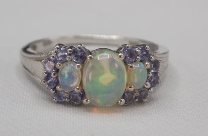 Beautiful 1 cwt opal and amethyst sterling silver ring.