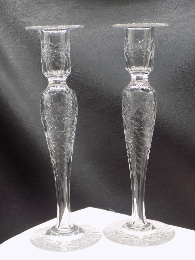 Beautiful pair of antique Pairpoint cut glass candle sticks: Beautiful pair of antique Pairpoint cut glass candle sticks. No markings. Beautiful colors. In very good original as found condition. Great quality and detail. 10 7/8 inches tall