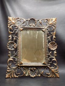 Ornate antique cast metal dresser mirror