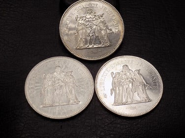 Three high grade 1977 50 silver francs coins