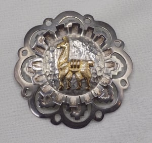 Beautiful vintage sterling with gold applied lama broach.