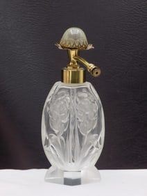 Lovely cut glass vintage perfume bottle with flowers.