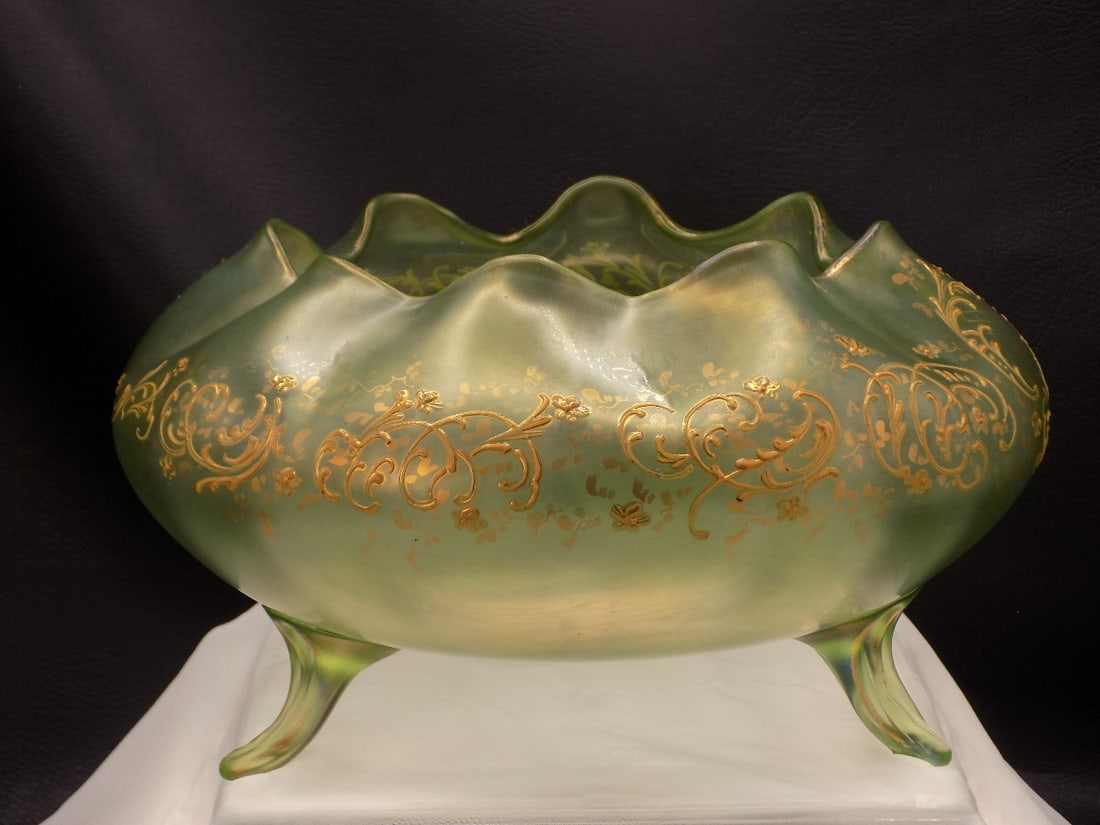 Lovely antique gold decorated Loetz footed art glass bowl: Lovely antique gold decorated Loetz footed art glass bowl. Nice iridescence. No signature. Beautiful colors. In very good original as found condition. Great quality and detail. 5 ¾ tall x 9 ¾