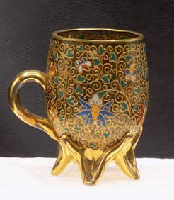 Antique elaborate enamel and gold decorated Moster footed cup.