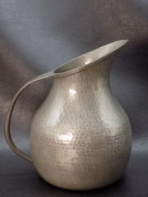 Vintage hand hammered Arts and Crafts pitcher.