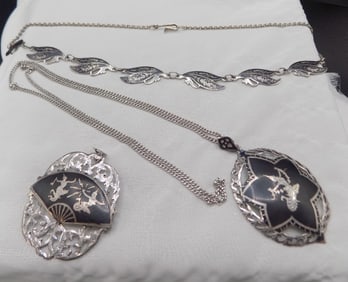 Two vintage sterling silver necklaces.