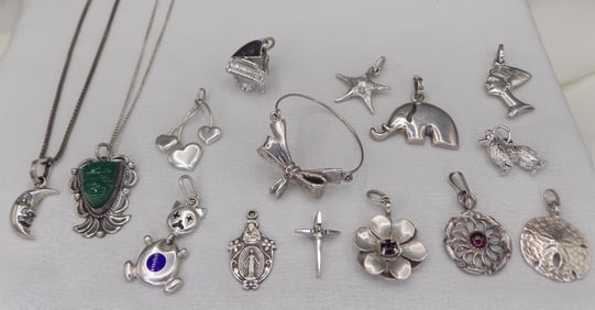 Fifteen neat sterling silver pendants and two chains