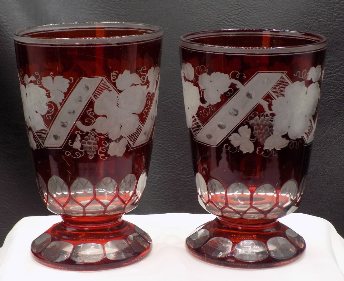 Exceptional vintage cranberry cut to clear pair of glasses.: Exceptional vintage cranberry cut to clear pair of glasses. . Beautiful design. Decorated with grapes and leaves for wine. Great quality and detail. In very good original as found condition. White dot