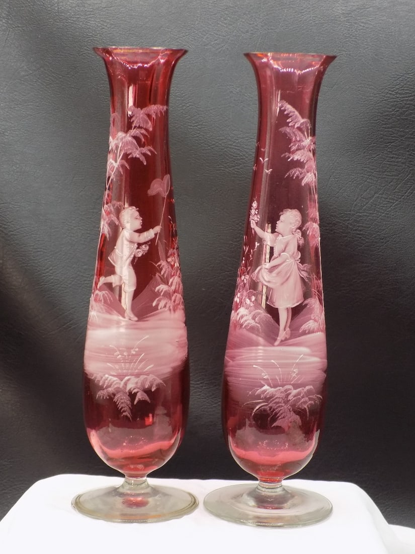 Beautiful pair of vintage enamel decorated cranberry art glass vases: Beautiful pair of vintage enamel decorated cranberry art glass vases. Enamel decorated with children. Ribbed panel cranberry glass. Beautiful colors. Great quality and detail. In very good original as