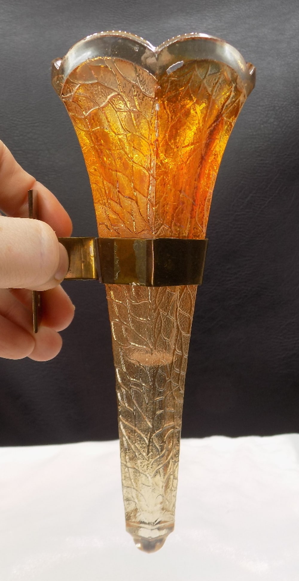 Hard to find antique automobile Carnival glass bud vase: Hard to find antique automobile Carnival glass bud vase. Attached in antique automobile interior. Beautiful marigold glass. Brass attachment. Great quality and detail. In very good original as found c