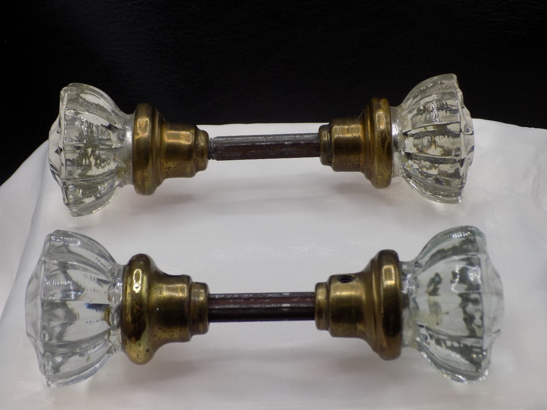 Pair of antique glass and brass knobs.: Pair of antique glass and brass knobs. Great quality and detail. In very good original as found condition. 6 inches long. 2 inches wide at top of knob