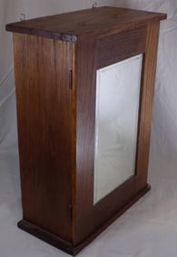 Antique oak medicine cabinet.