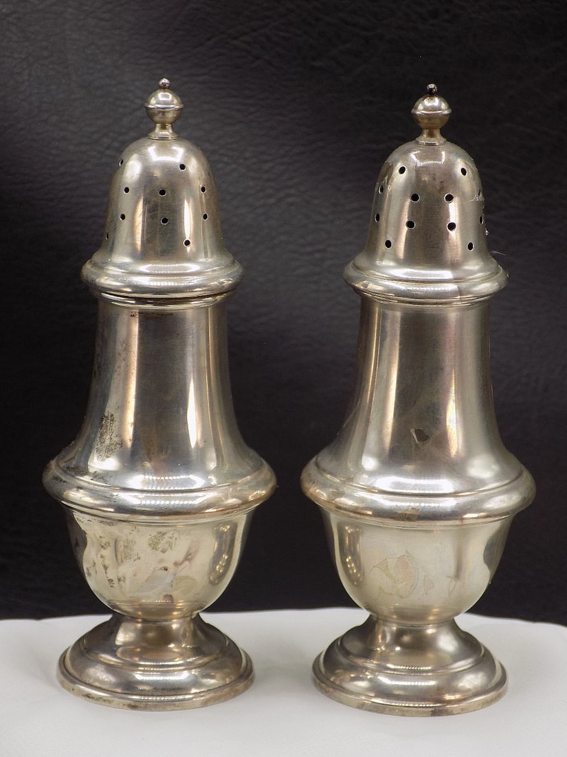 Nice pair of sterling silver salt and pepper shakers.