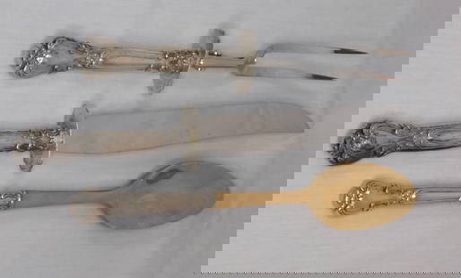 Vintage sterling silver handles carving set and spoon: Vintage sterling silver handles carving set and spoon. Not marked, but tested sterling. Great quality and detail. Knife 13 inches long. Spoon 11 inches.
