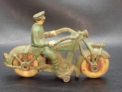 Antique cast iron Champion toy motorcycle: Antique cast iron Champion toy motorcycle. Original green paint with wear as shown in photos. Marked Champion on the gas tank. Probably Arcade. 4 5/8 inches tall x 7 long