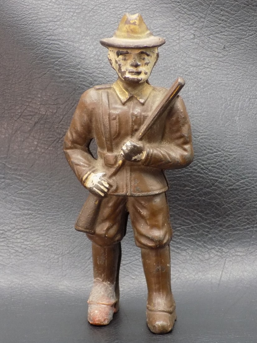 Vintage cast iron soldier bank: Vintage cast iron soldier bank. Original paint and patina with wear from use and age as shown in photos. Patina off of right foot. Great quality and detail. 6 inches tall.