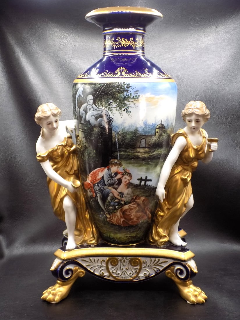 Spectacular Meissen hand painted with figures at sides.: Spectacular Meissen hand painted with figures at sides. Artist signed as shown in photo. Cross sword mark on bottom. Exceptional detail and quality. Beautiful colors. Gold highlight decoration. In ver