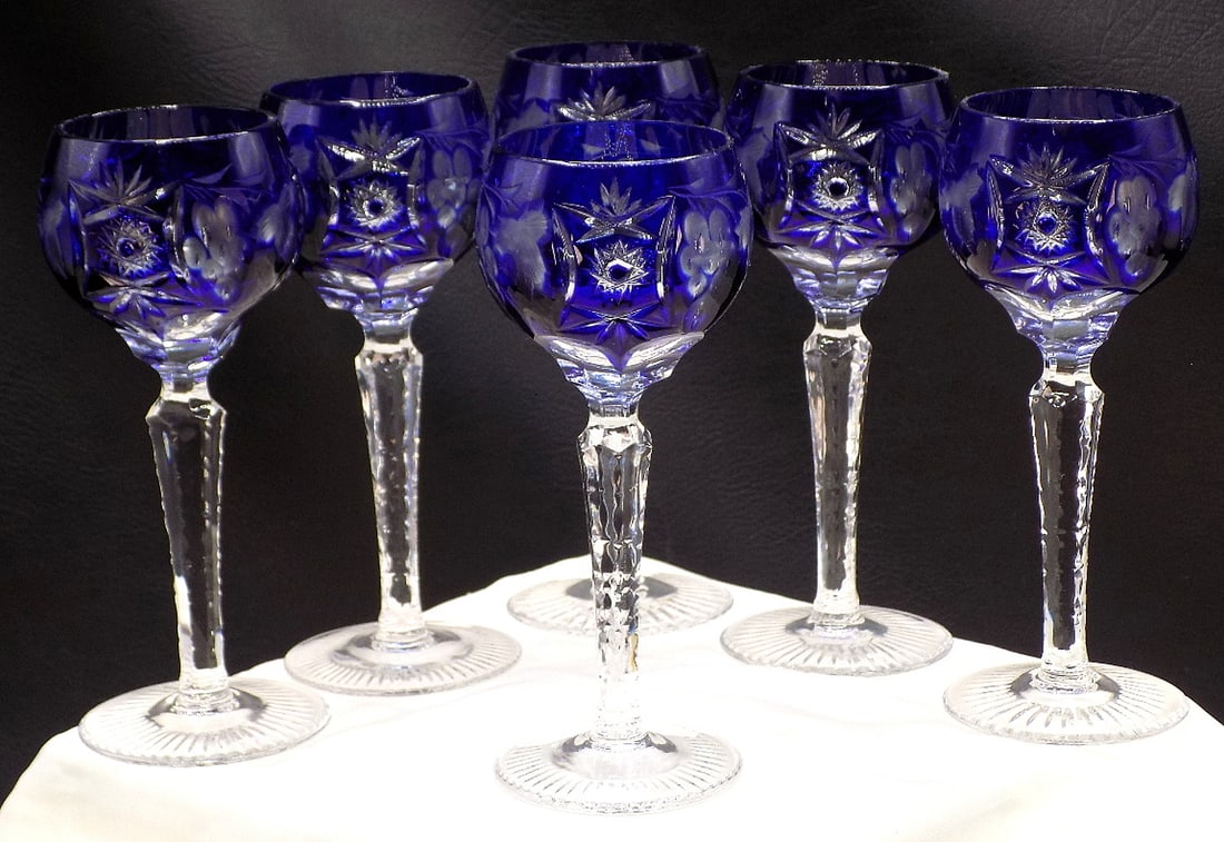Beautiful set of six vintage cobalt blue cut to clear wine glasses: Beautiful set of six vintage cobalt blue cut to clear wine glasses. Beautiful colors. Great quality and detail. In very good original as found condition. 5 3/8 inches tall x 1 7/8 wide at top rim. Mat
