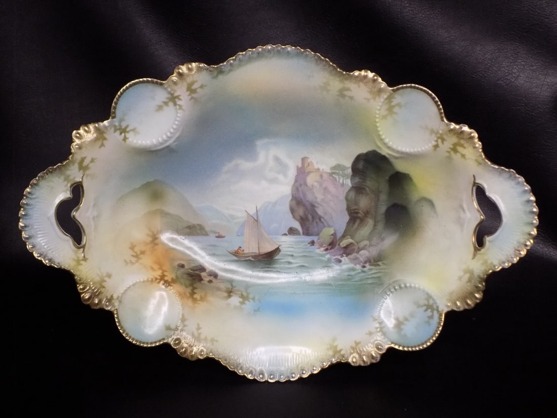 Beautiful vintage RS Prussia bread or serving bowl with ship: Beautiful vintage RS Prussia bread or serving bowl with ship in lake and mountain scene. Gold highlight on rim. Beautiful molded shape with open handles. Great quality and detail. Marked on bottom as 
