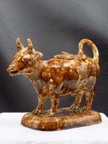 Vintage Bennington art pottery cow cream pitcher.