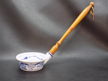 Vintage blue onion porcelain ladle with wood handle.