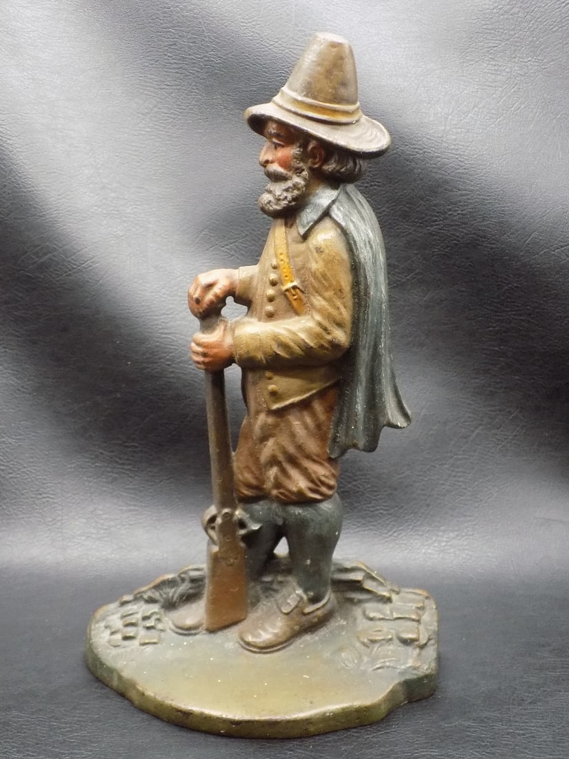 Antique cast iron Bradley and Hubbard Pilgrim Door Stop: Antique cast iron Bradley and Hubbard Pilgrim Door Stop. Original paint. Beautiful colors. Great quality and detail. Marked B and H on bottom as shown in photo. 10 ¼ inches tall x 6 ¼ inches