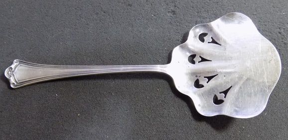 Antique sterling silver tomato spoon