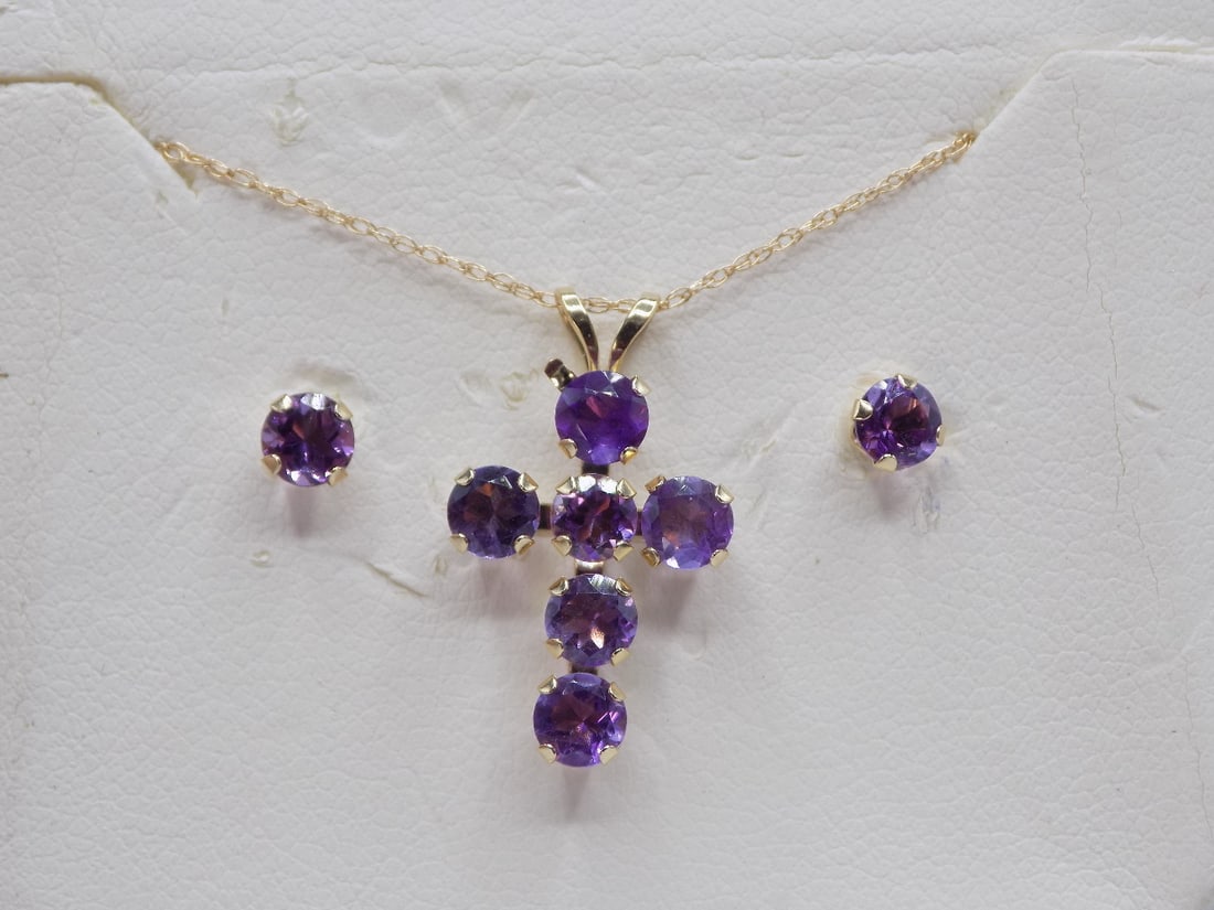 Beautiful 10k three piece amethyst cross with earrings: Beautiful 10k three piece amethyst cross with earrings. Cross ¾ inch tall. Necklace 18 inches
