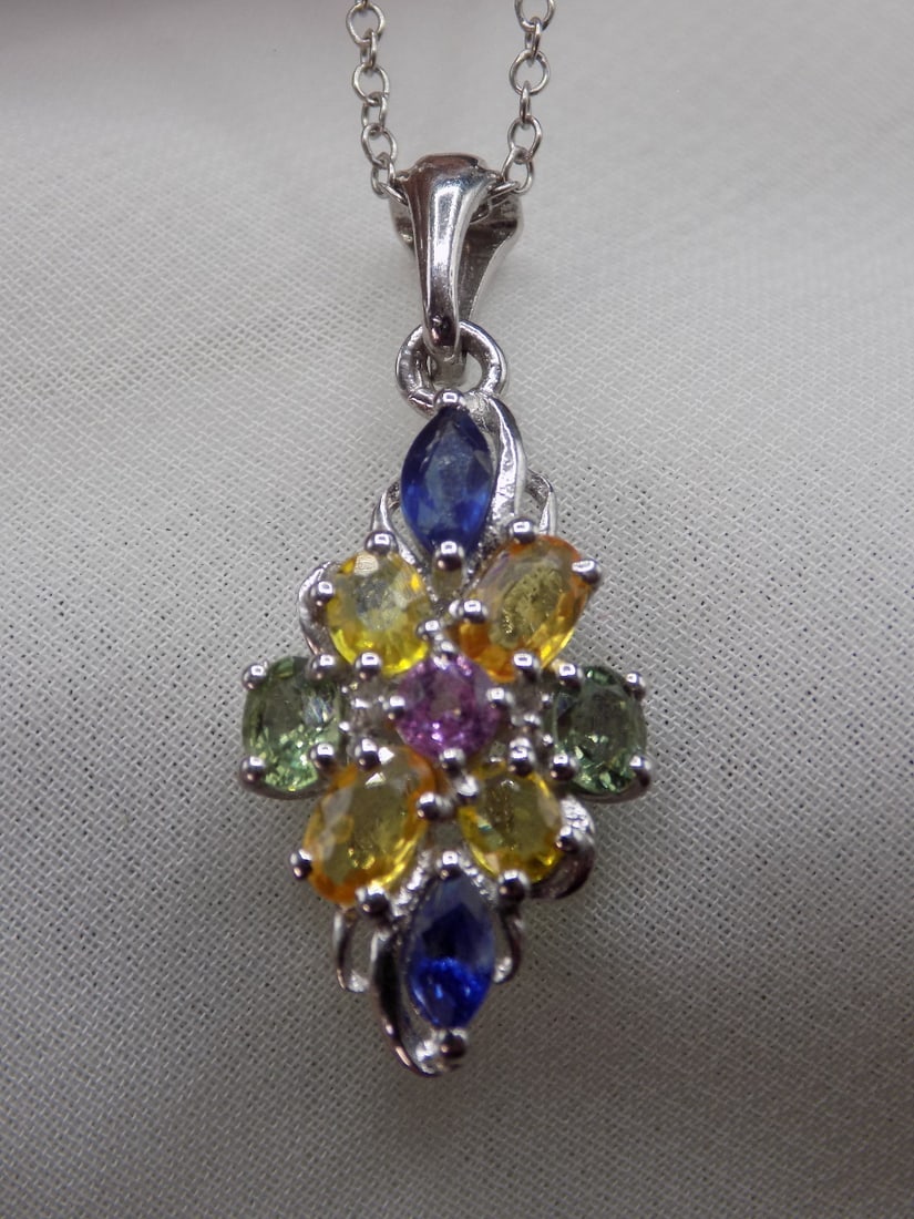 Beautiful sapphire, citrine, topaz, and pink sapphire sterling silver necklace: Beautiful sapphire, citrine, topaz, and pink sapphire sterling silver necklace. Pendant 7/8 inches tall. Chain 19 inches