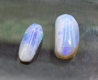Two fire opal gemstones
