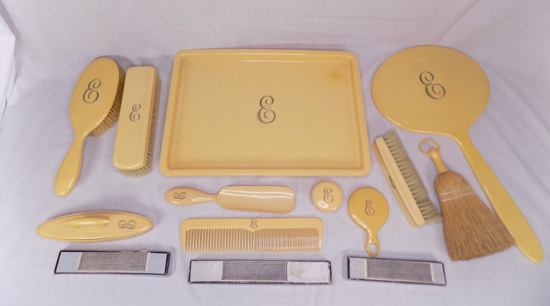 Vintage Parisian ivory Loonen France dresser set: Vintage Parisian ivory Loonen France dresser set. Great quality and detail. Hard to find a set with this many pieces. Fourteen pieces. Tray measures 12 ¾ by 9 inches