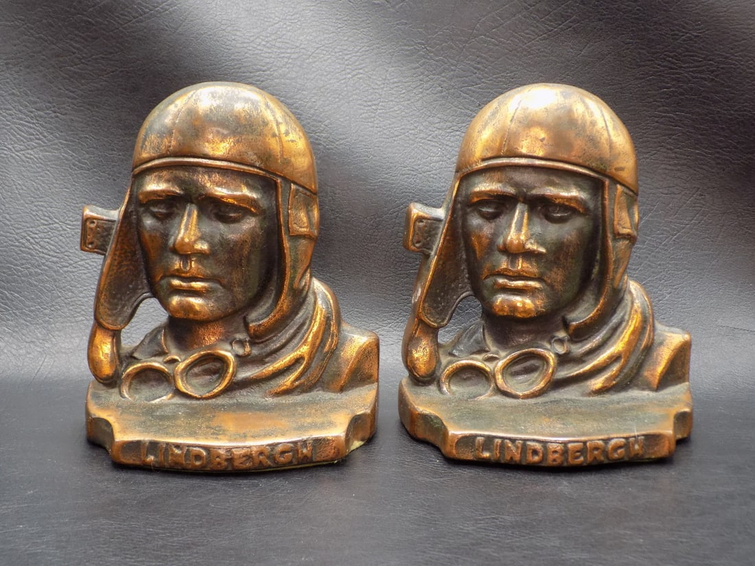 Vintage Charles Lindbergh The Aviator bookends: Vintage Charles Lindbergh The Aviator bookends. Cast iron with original patina. Beautiful colors. Great quality and detail. 5 1/4 inches tall