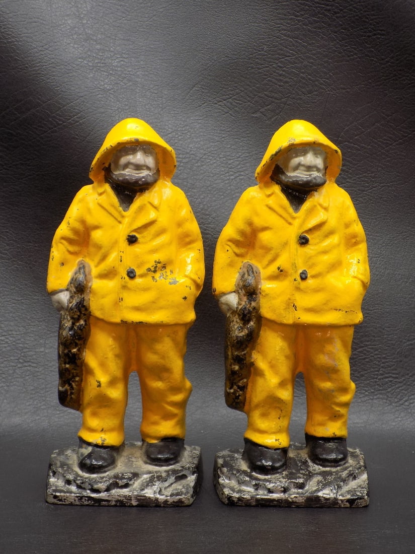 Vintage cast iron fishermen or sailors bookends.: Vintage cast iron fishermen or sailors bookends. Beautiful colors. Has minor wear to paint normal from use and age. Great quality and detail. 6 1/4 inches tall