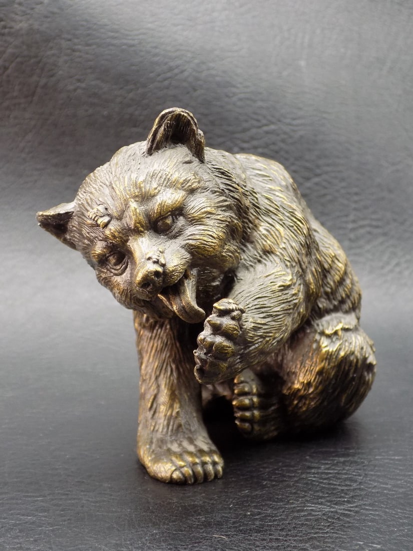 Neat vintage bronze bear with bees.: Neat vintage bronze bear with bees. Beautiful colors. Great quality and detail. 3 3/8 inches long and 2 3/4 inches tall