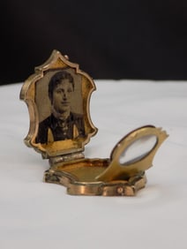 Unusual antique gold filled daguerreotype pendant.