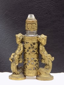 Charming ornate antique perfume bottle with cupids