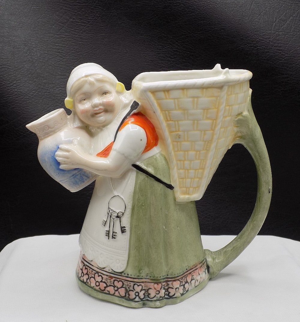 Charming vintage Schafer and Vater Dutch Girl cream pitcher: Charming vintage Schafer and Vater Dutch Girl cream pitcher.. Marked Made in Germany as shown in photo. In very good original as found condition. 5 1/8 inches tall
