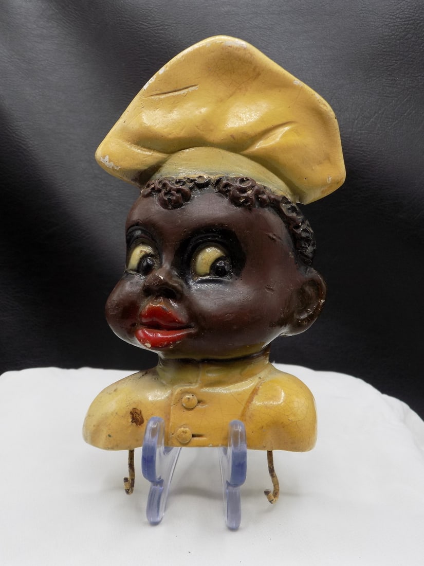 Vintage Black memorabilia hanging hot pad holder: Vintage Black memorabilia hanging hot pad holder. Shows wear normal from age and use. Please see photos. Original paint. Made of hard chalk. Partial label on back. Total height 7 1/8 inches x 4 wide a