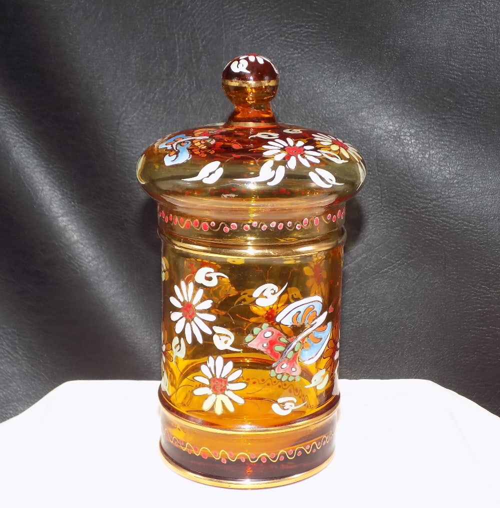 Vintage decorated art glass covered jar: Vintage decorated art glass covered jar. Amber glass with enamel decoration with flowers and butterfly. Beautiful colors. Great quality and detail. In very good original as found condition. 6 3/4 tall