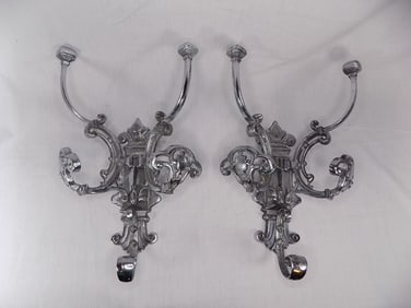 Exceptional pair of antique nickel plated hat and coat wall racks.