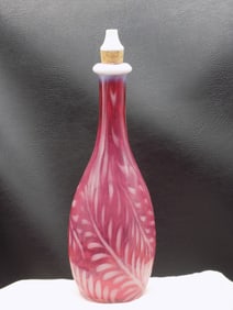 Antique cranberry and opalescent decorated barber bottle